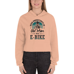 Never Underestimate an Old Man with an E-bike Bella + Canvas 7502 Women’s Cropped Hoodie Peach
